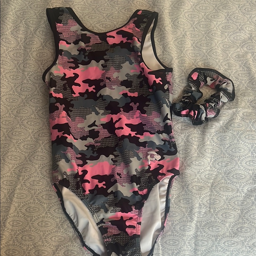 Plum leotard size child large with matching scrunchie. Worn once or twice.